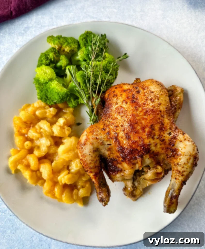 Perfect Slow Cooker Cornish Hens 2 slow cooker Crockpot cornish hen on a plate with mac and cheese and brocooli