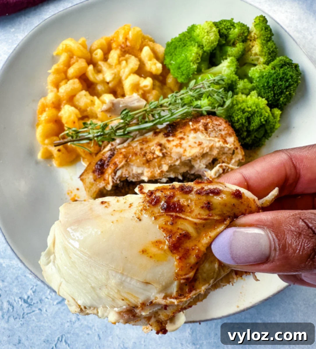 Perfect Slow Cooker Cornish Hens 11 person holding a piece of Crockpot Cornish hens