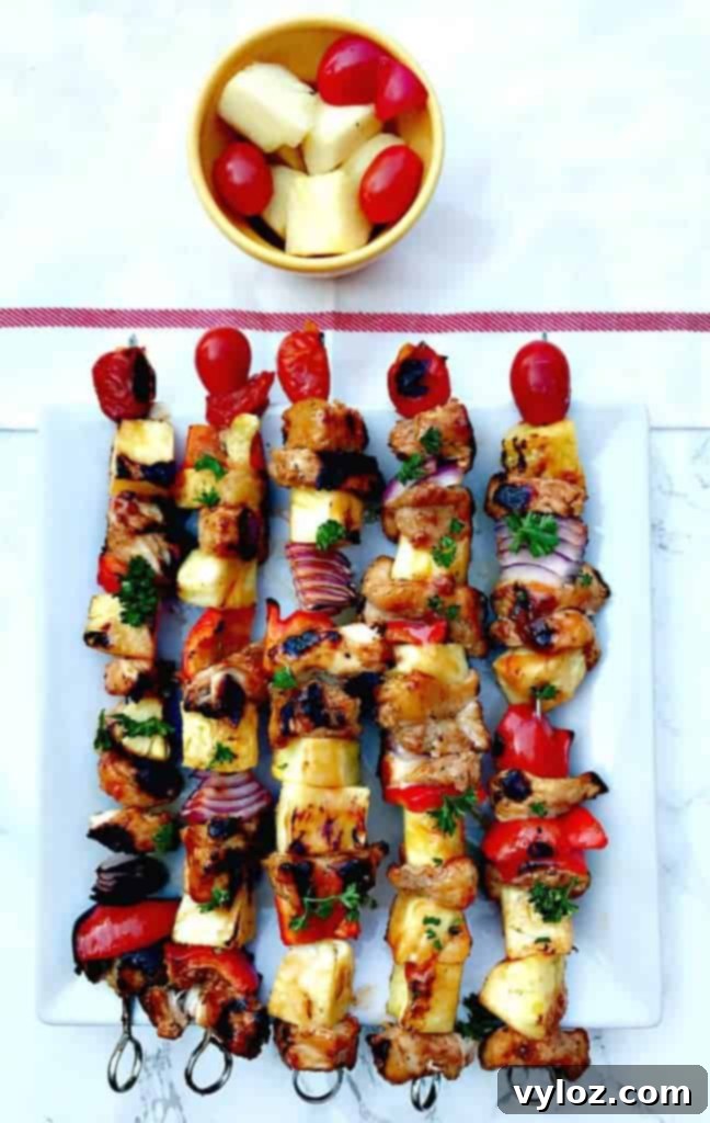 Aloha Grilled Chicken and Pineapple Skewers 6 Multiple Hawaiian pineapple chicken skewers artfully arranged, showcasing their appeal.
