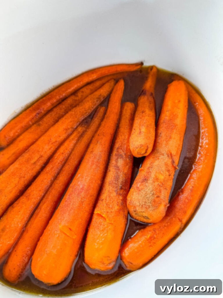 Maple glazed carrots served in a Crockpot slow cooker, ready to be enjoyed.