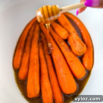 Maple syrup drizzled over carrots in a Crockpot slow cooker