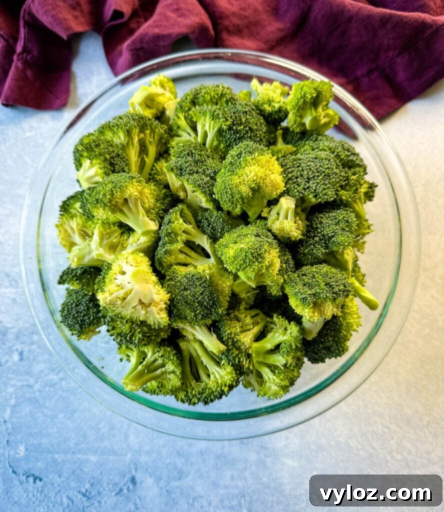 fresh broccoli florets in a glass bowl