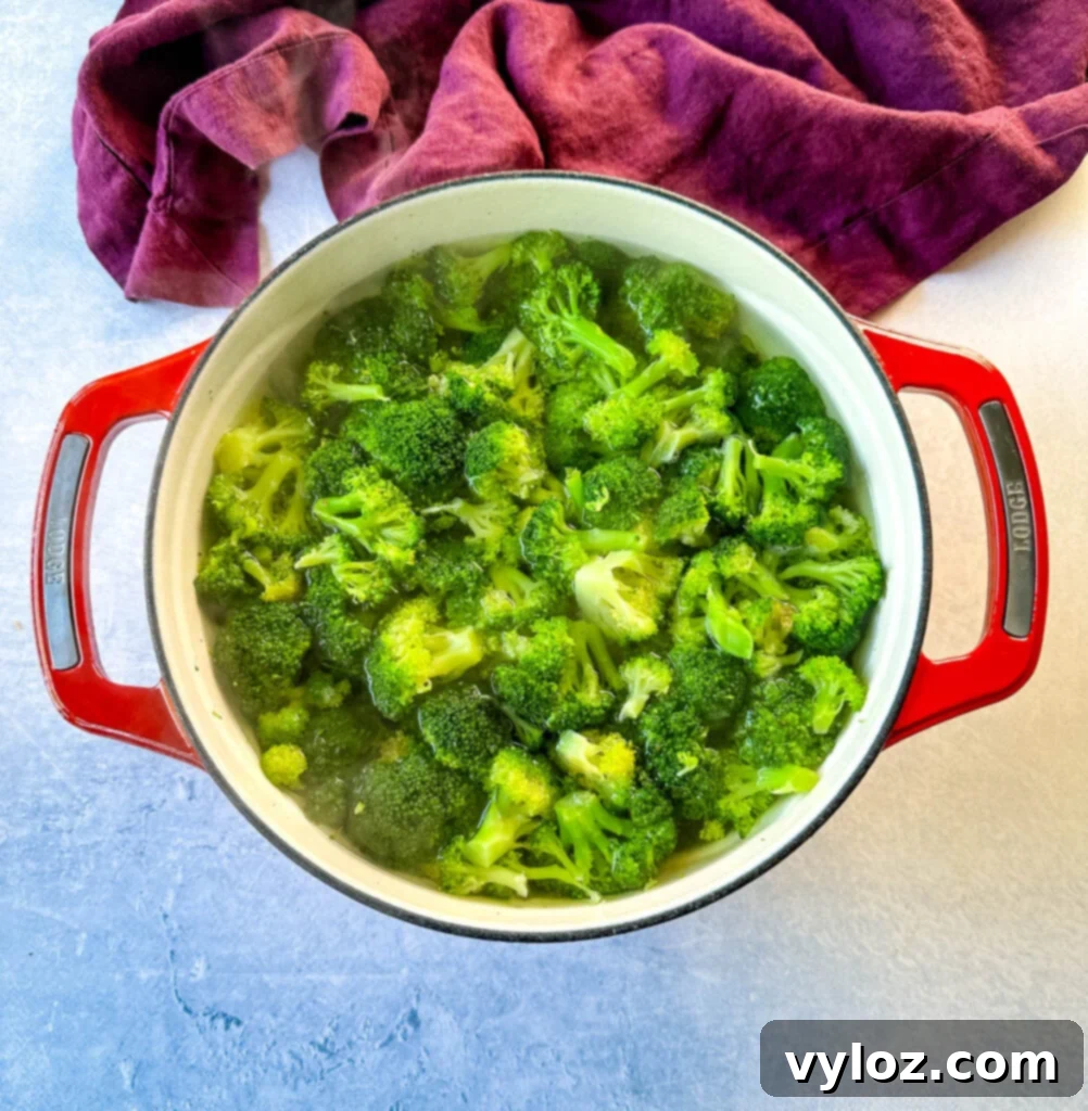 blanched broccoli in a Dutch oven with water