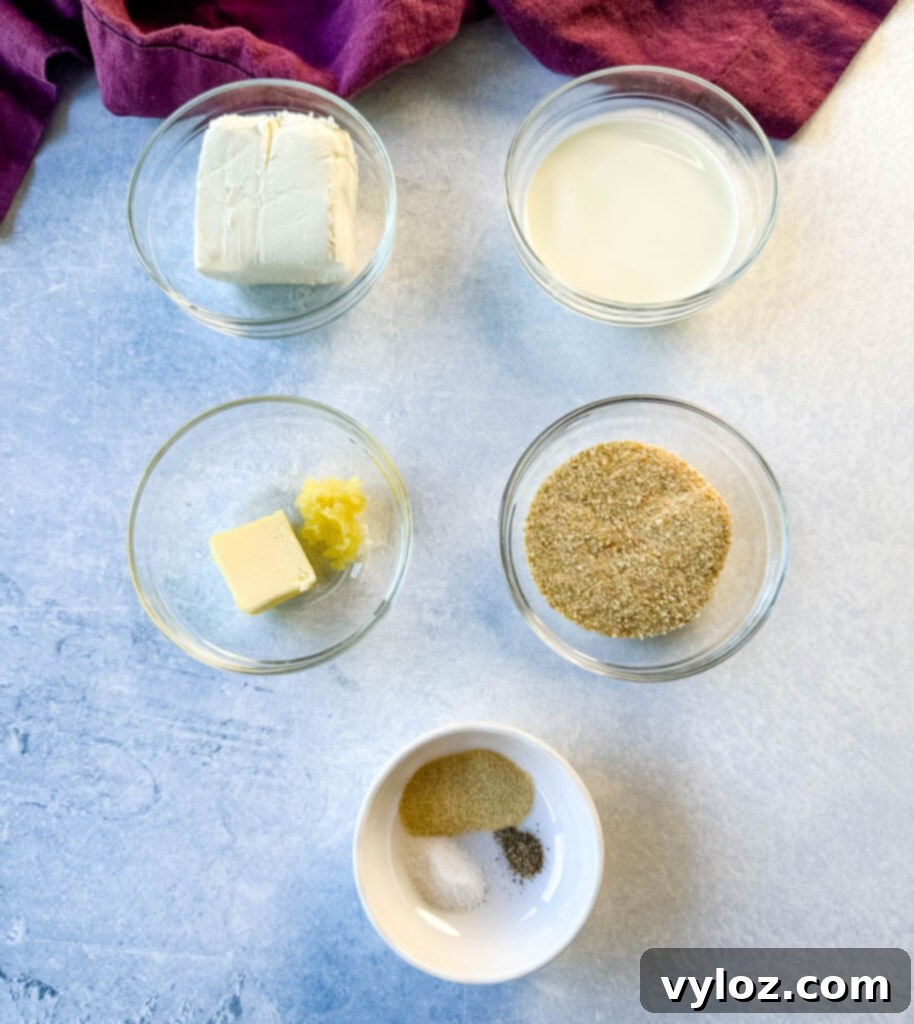 cream cheese, heavy cream, butter, breadcrumbs, and spices in separate glass bowls