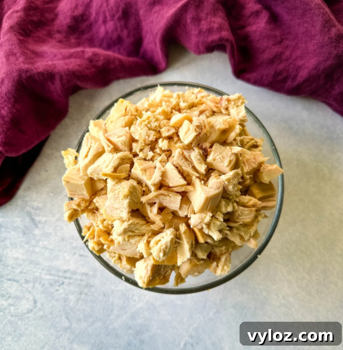 chunks of rotisserie chicken in a glass bowl
