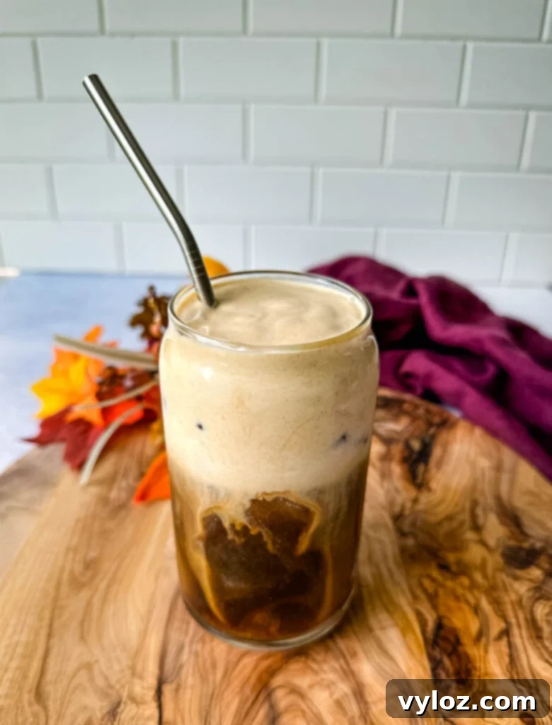 Guilt-Free Pumpkin Spice Cold Brew 2 pumpkin cream cold brew coffee in a glass cup with a straw