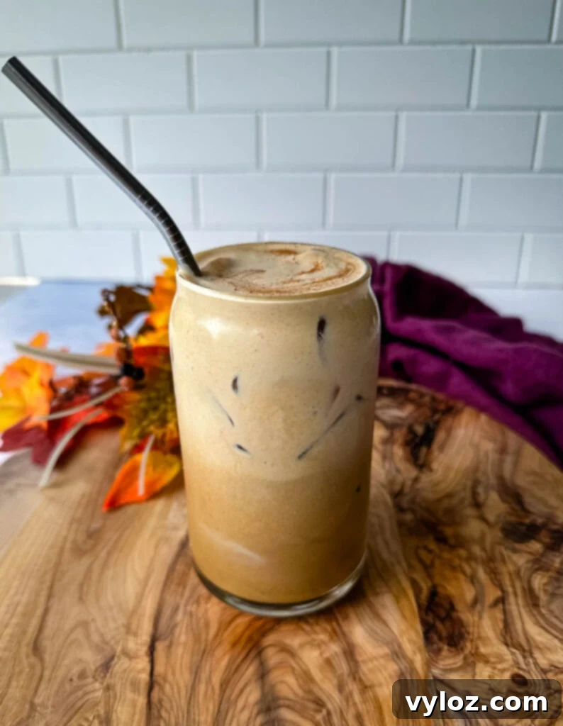 Guilt-Free Pumpkin Spice Cold Brew 11 pumpkin cream cold brew coffee in a glass cup with a straw