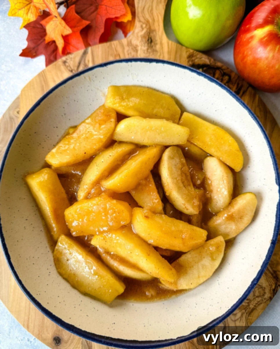 slow cooker Crockpot baked apples in a white bowl