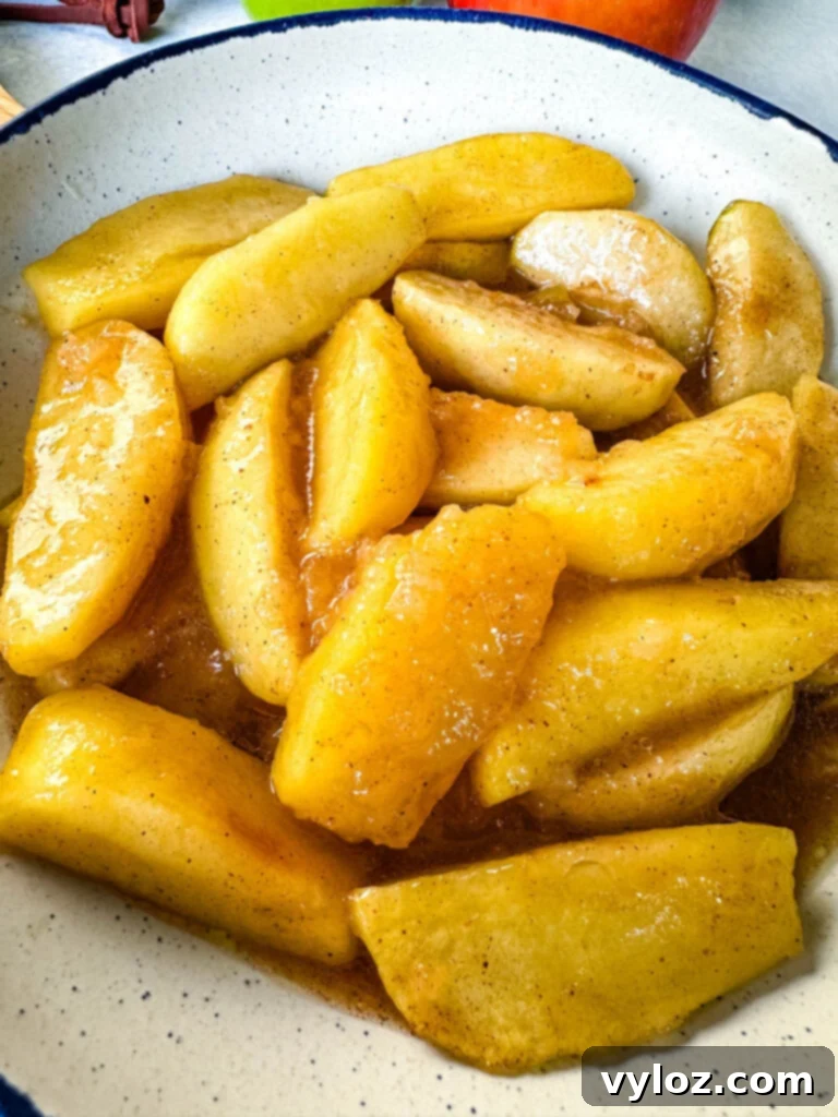 slow cooker Crockpot baked apples in a white bowl