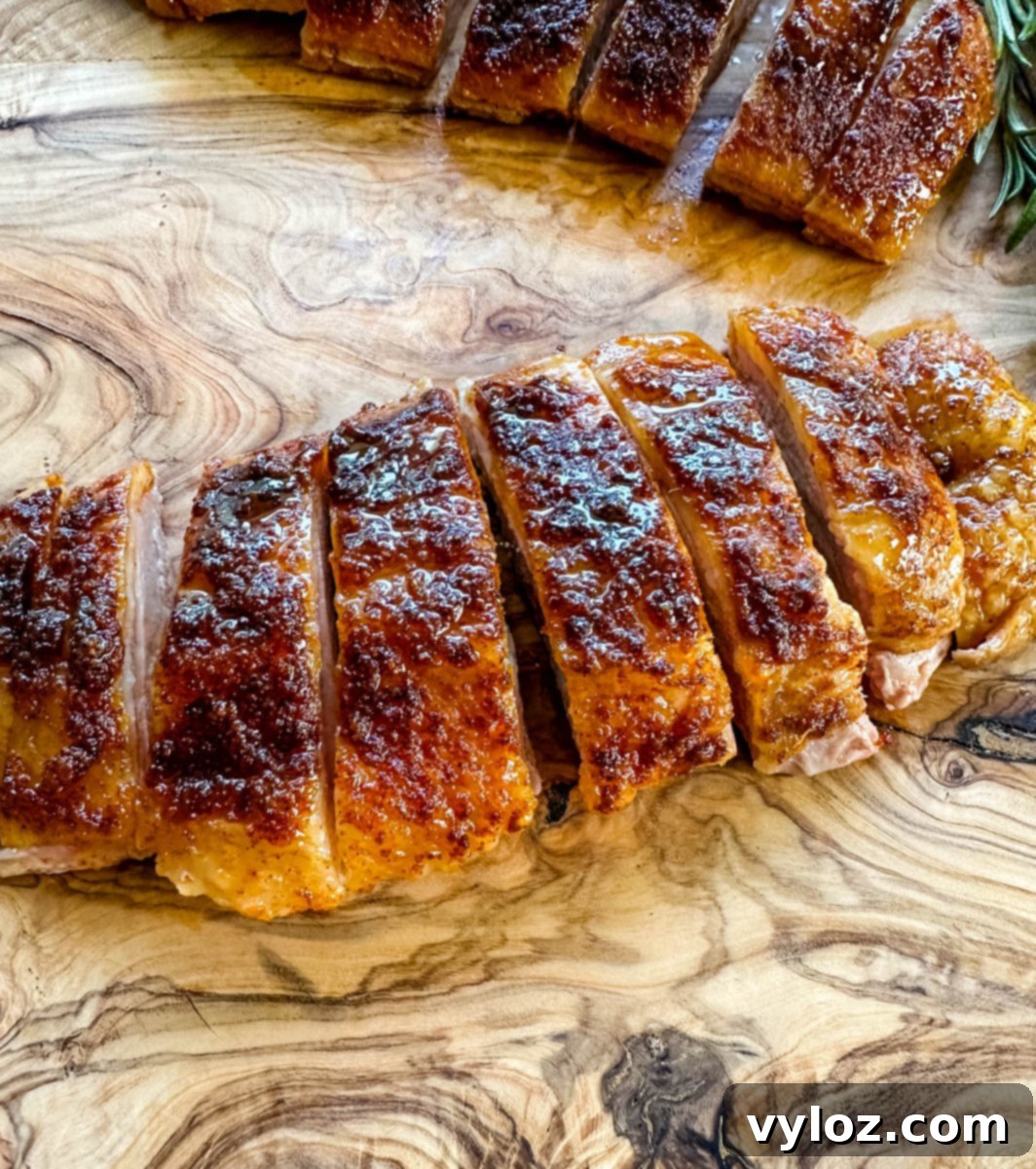 Mastering Smoked Duck 13 smoked duck breast sliced on a wooden cutting board