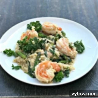 No-Stir Creamy Instant Pot Shrimp Risotto 14 Lemon Shrimp Risotto with Vegetables and Parmesan served on a white plate