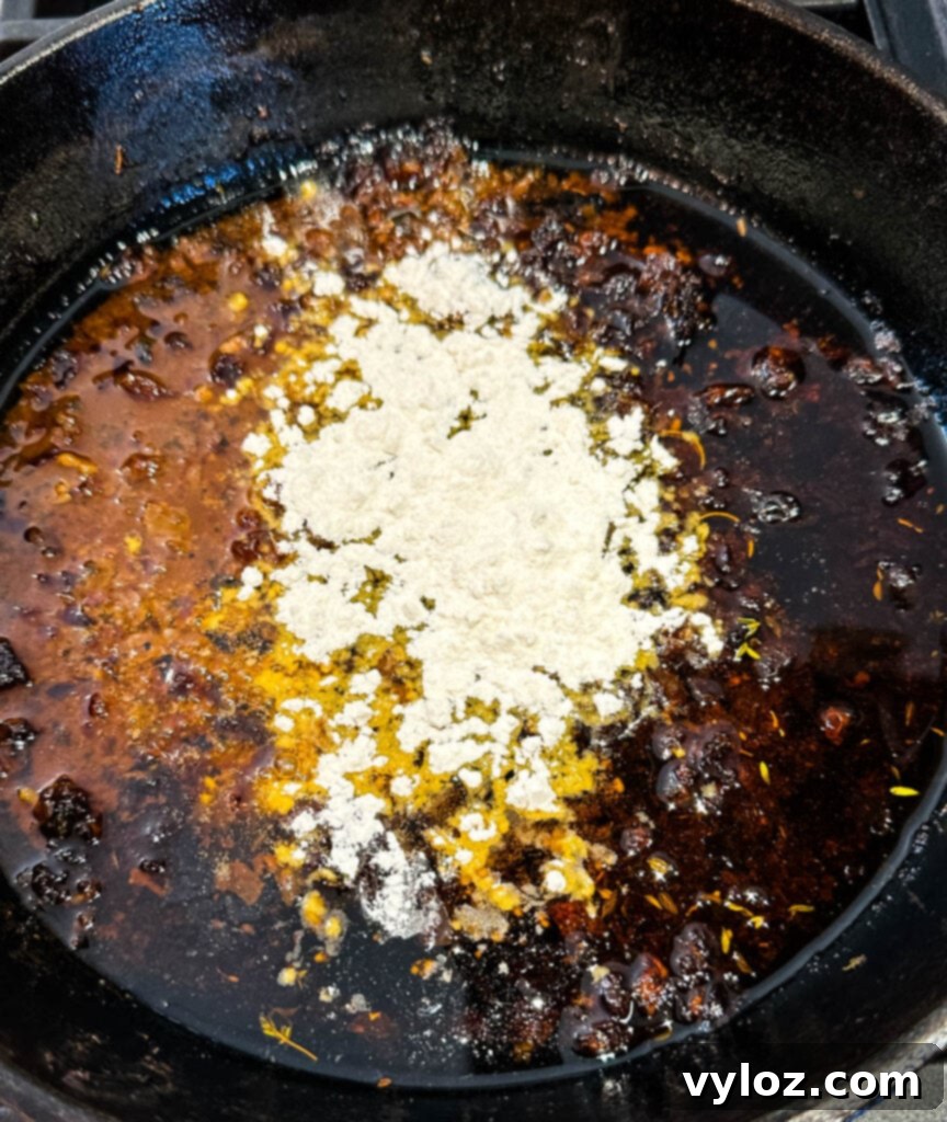 prime rib drippings, herbs, butter, and flour in a cast iron skillet