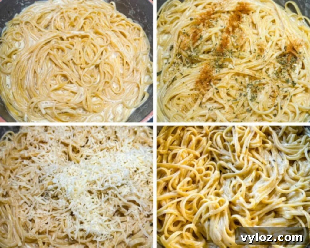 Linguine in a pan with Alfredo sauce, being stirred with Parmesan cheese and spices, ready to absorb flavor.