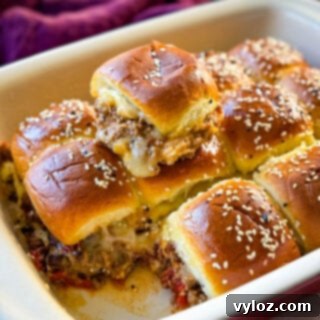 Kings Hawaiian Sliders with cheese in a red baking dish