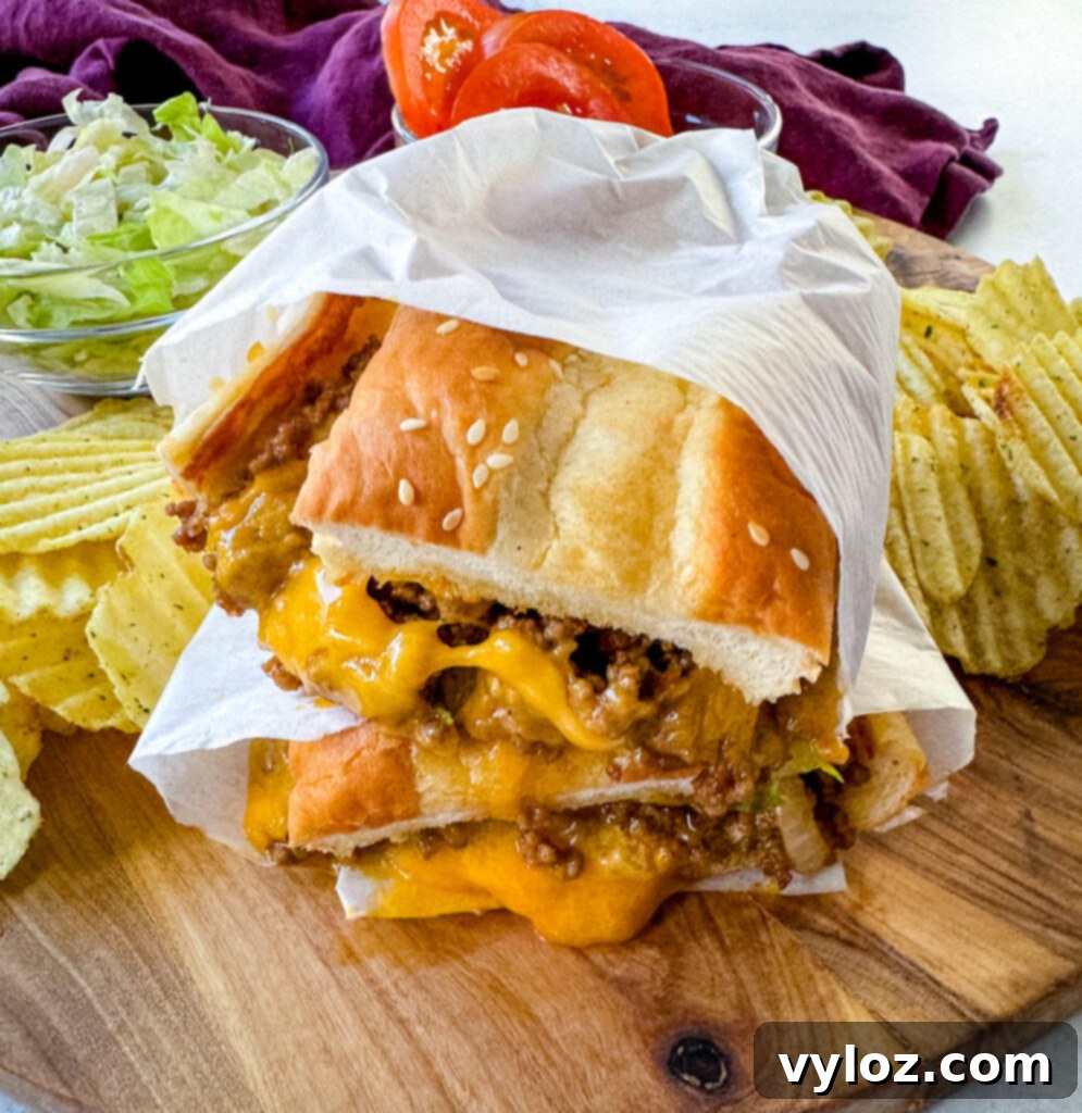 chopped cheese sandwich with lettuce and tomatoes in a wrapper