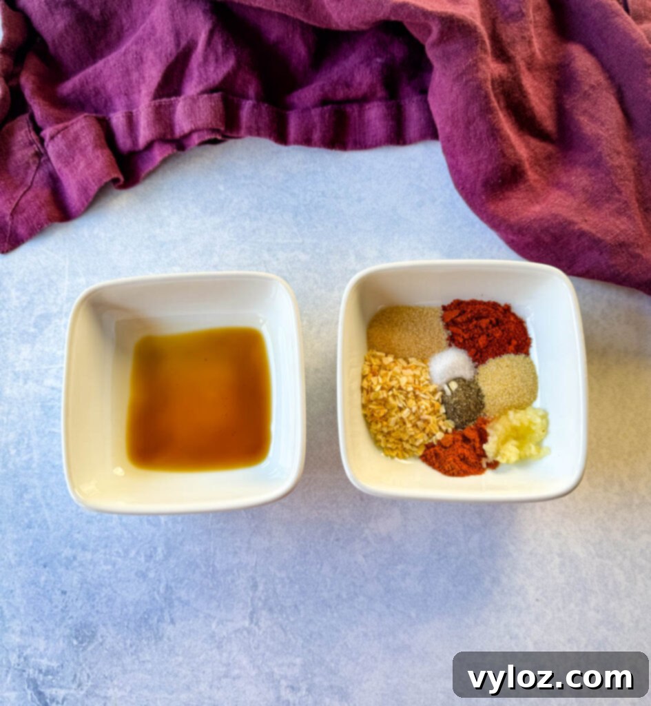 homemade burger seasoning spices in a white bowl and Horcestershire sauce in a white bowl