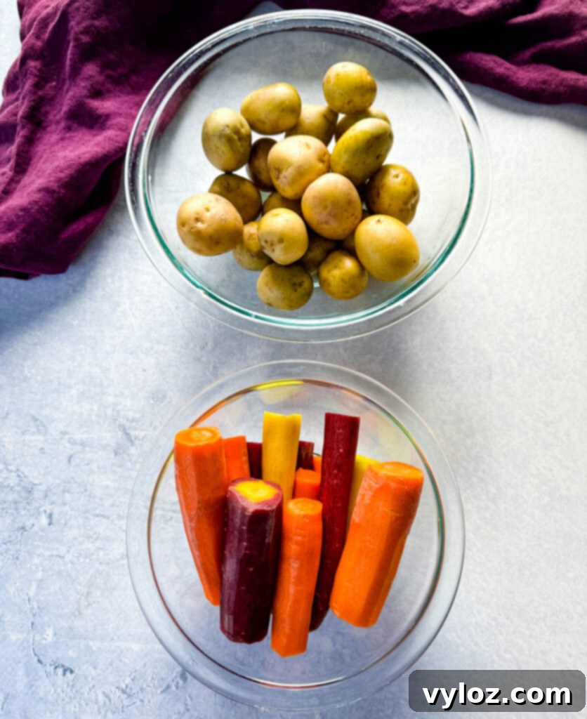Melt-in-Your-Mouth Slow Cooker Beef Roast 8 baby potatoes and carrots in separate glass bowls