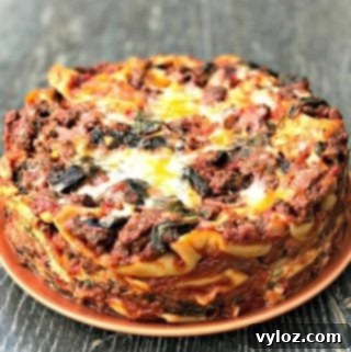 spinach lasagna on an orange plate