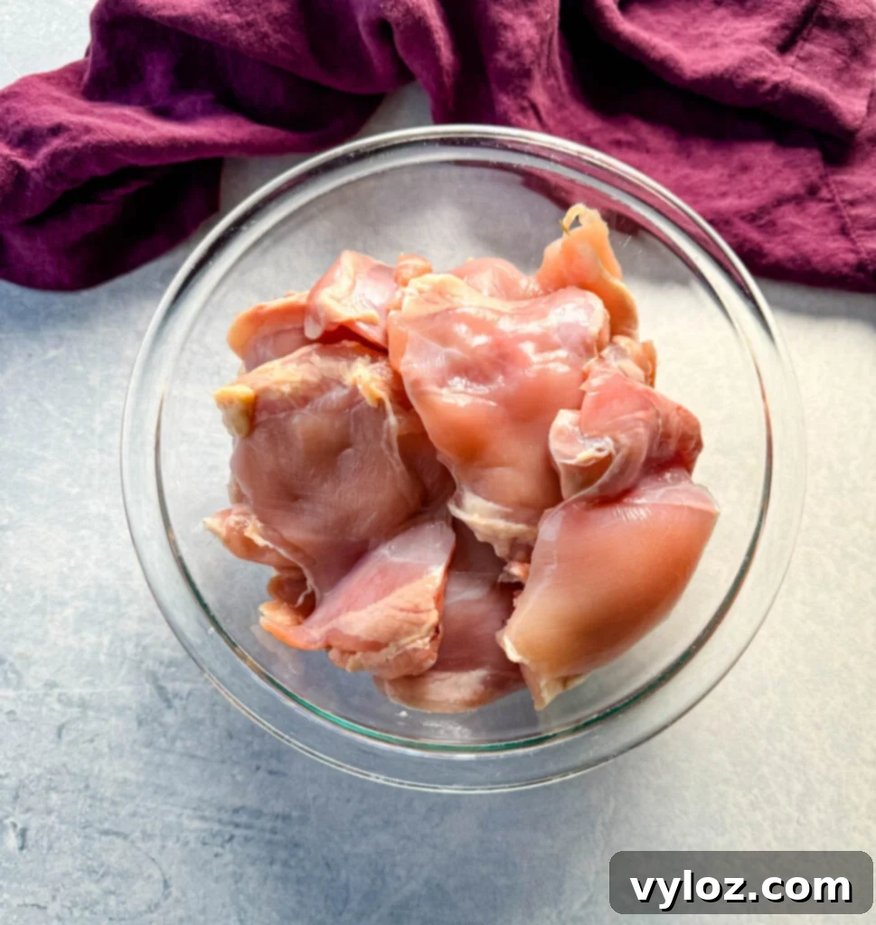 raw chicken thighs in a glass bowl