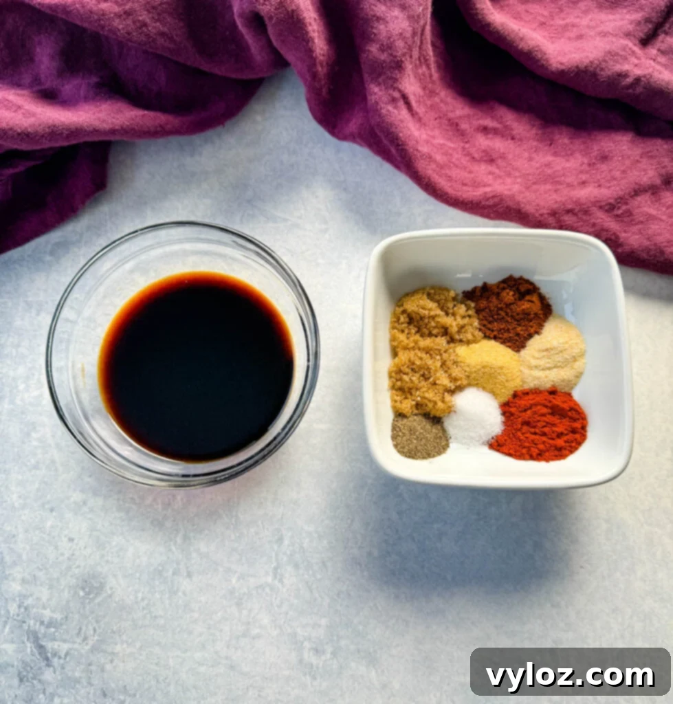 soy sauce in a glass bowl with homemade BBQ rub spices in a white bowl