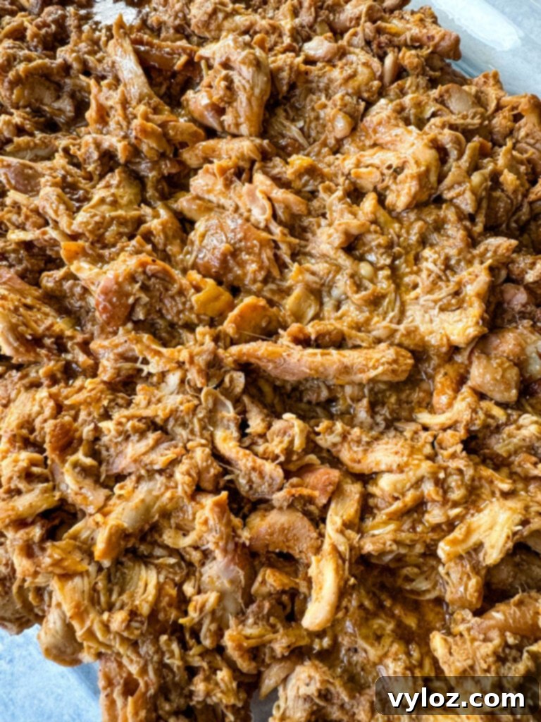 Smoky Traeger Pulled Chicken 11 smoked pulled chicken on a clear serving tray