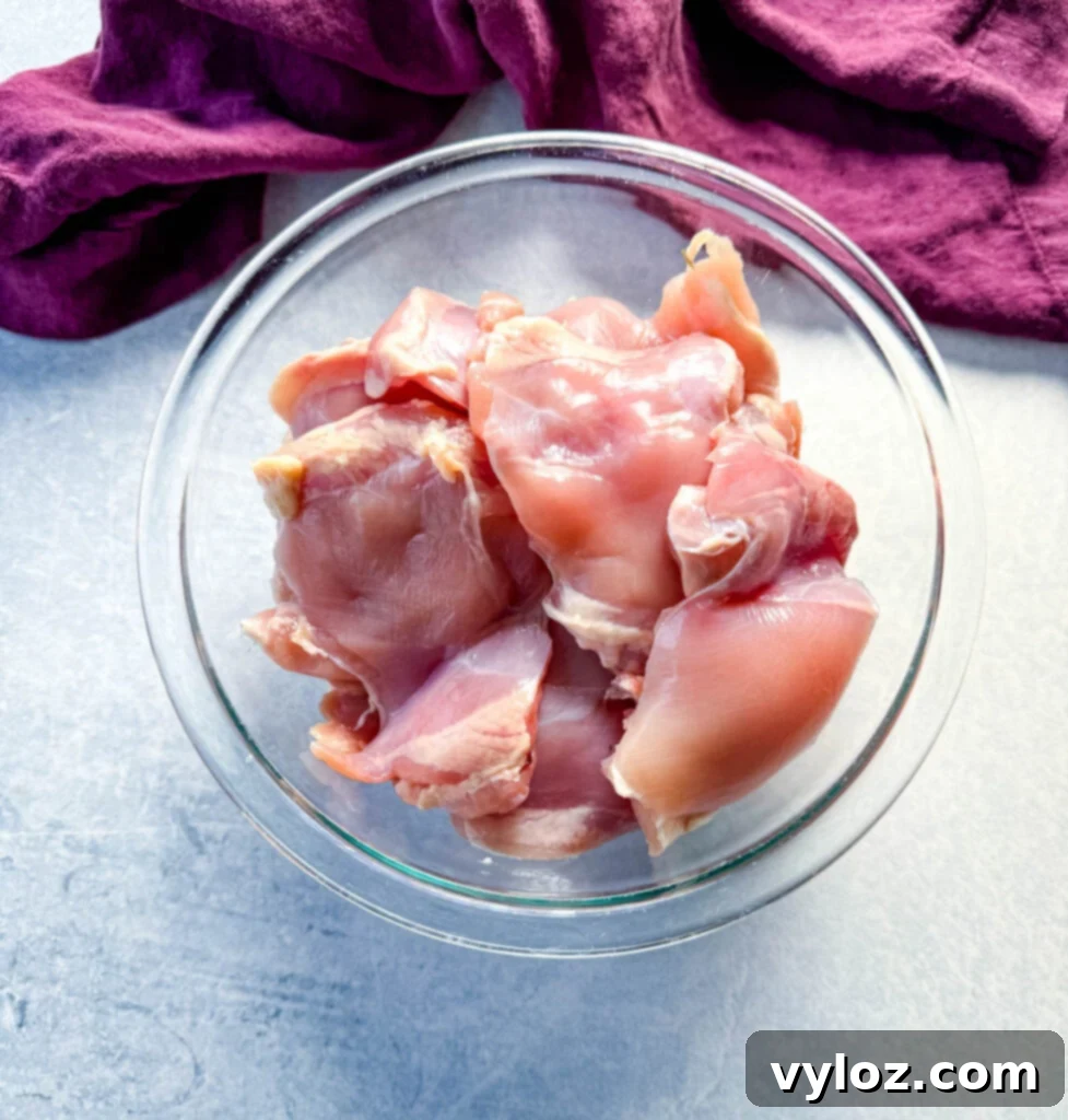 Smoky Traeger Pulled Chicken 3 raw chicken thighs in a glass bowl