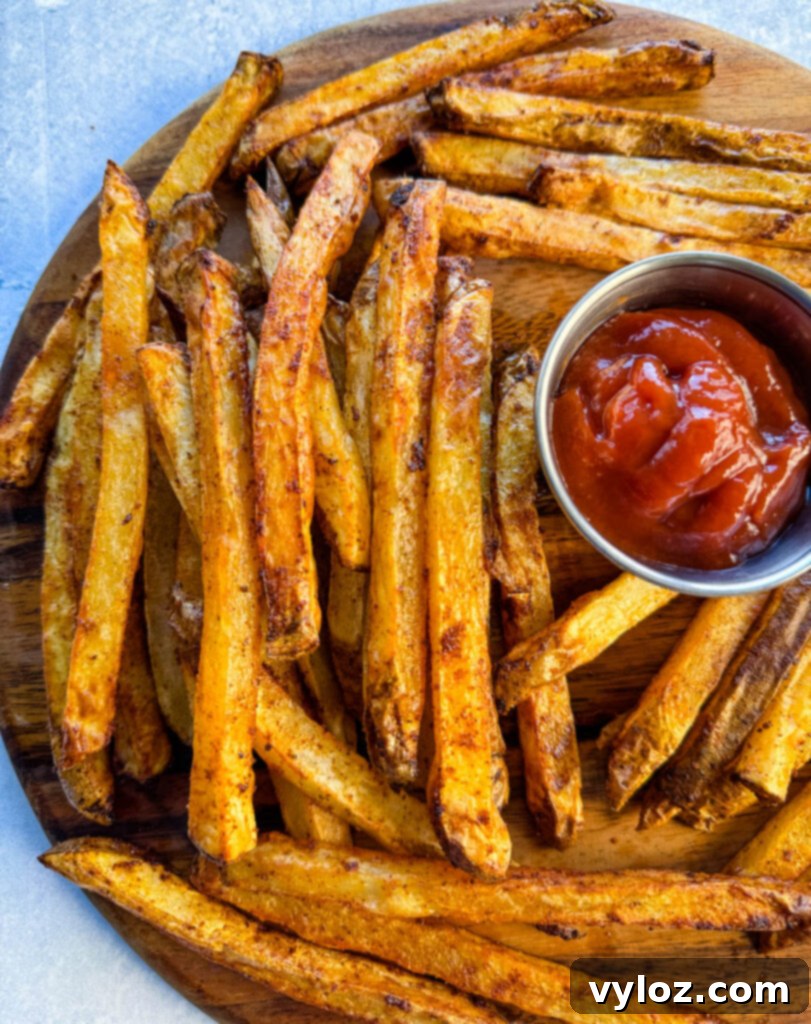 Cajun Seasoned Fries 13 Cajun fries on a platter with ketchup