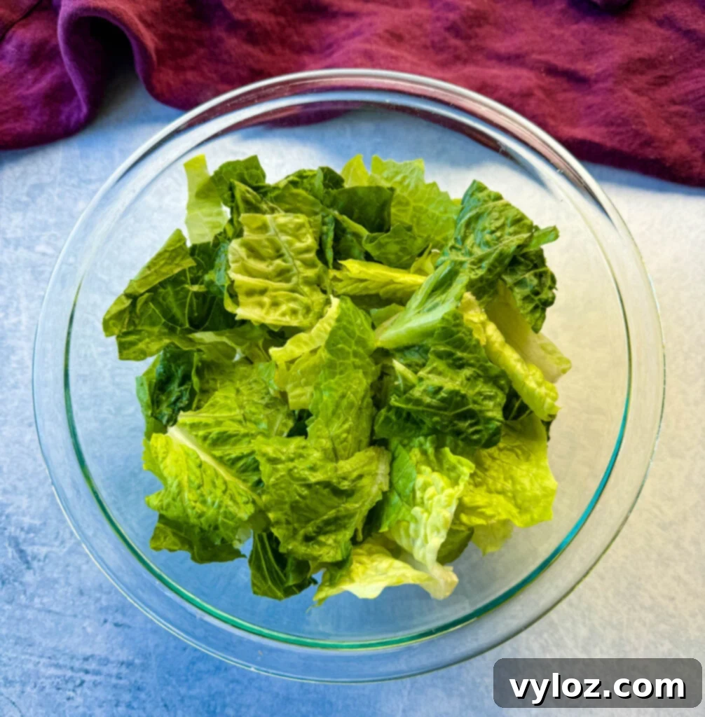fresh romaine lettuce in a glass bowl