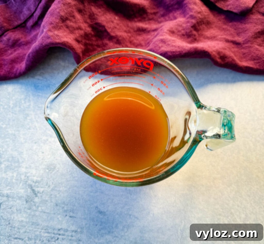 beef stock/ broth in a glass bowl