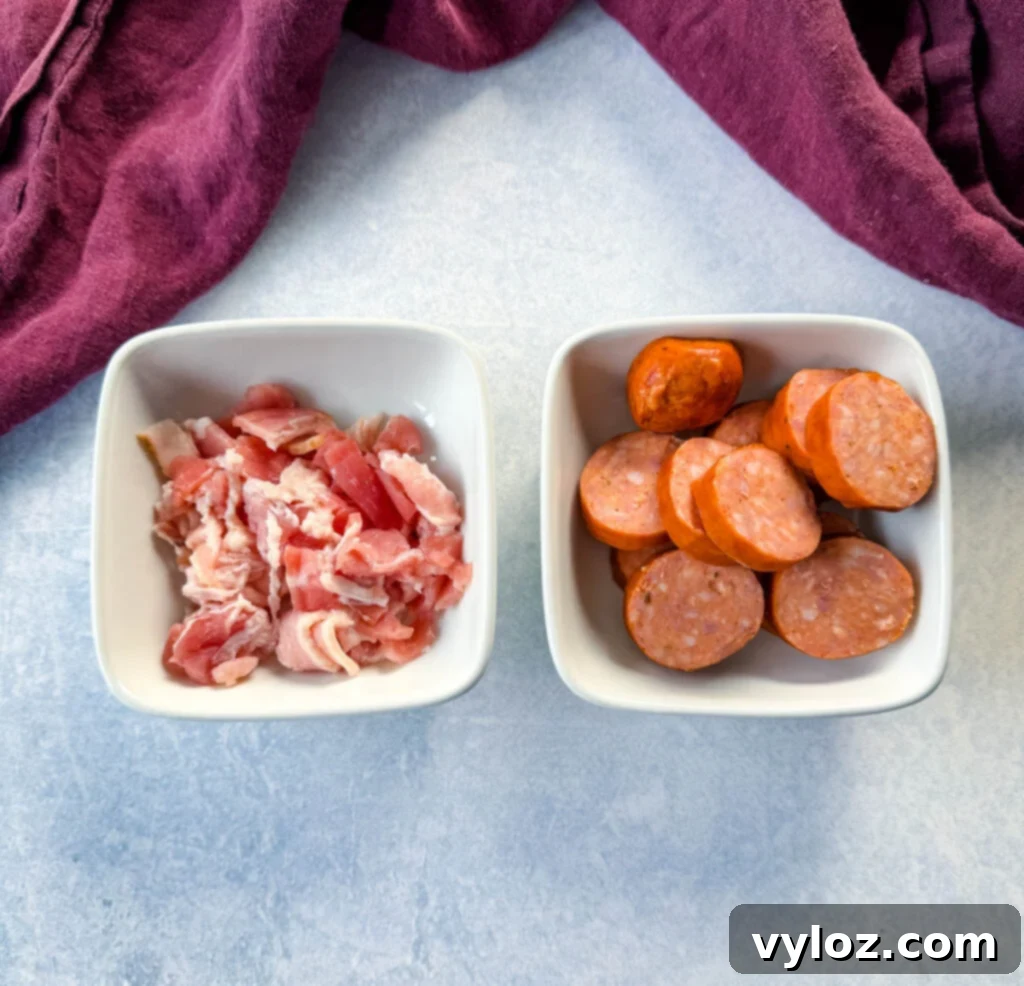 uncooked bacon and sausage in white bowls