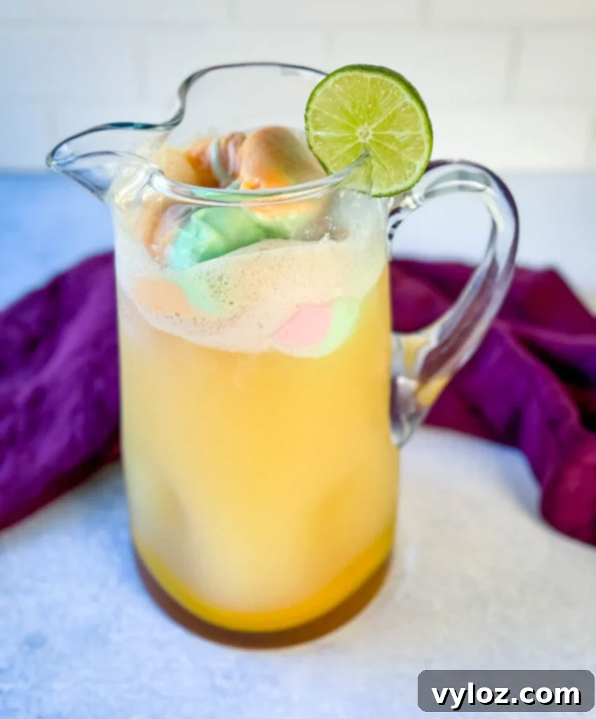 Kaleidoscope Sherbet Punch 6 rainbow sherbet punch in a glass pitcher