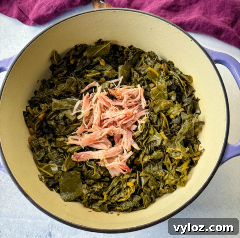 Southern Mixed Greens Medley 8 Mixed collard, turnip, mustard greens, and kale simmering in a Dutch oven alongside smoked turkey, half-cooked.
