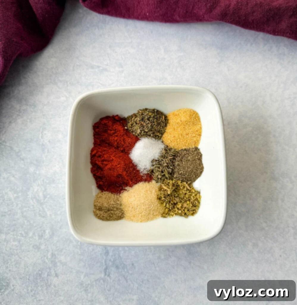 close up of collard greens seasoning dry spices in a pristine white bowl, showcasing the vibrant colors and textures of the blend