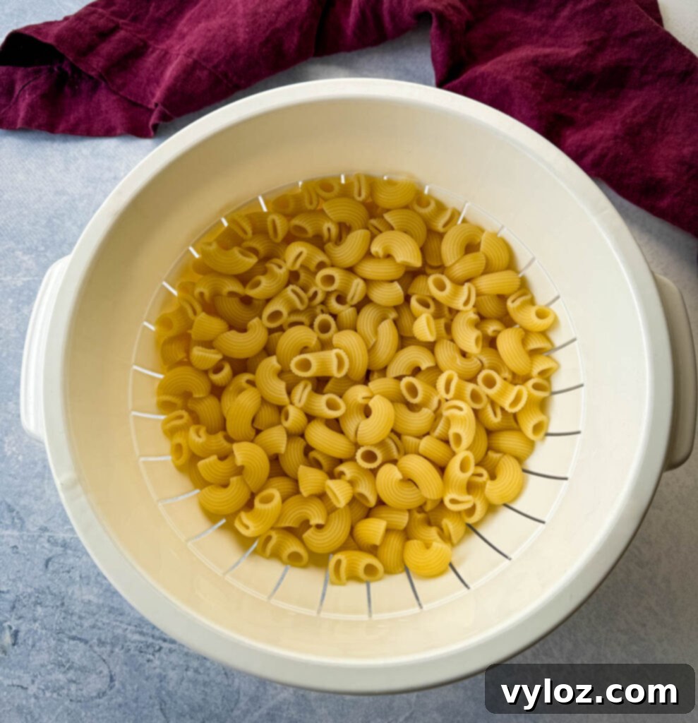 Classic Ham Pasta Salad 4 cooked macaroni pasta in a colander