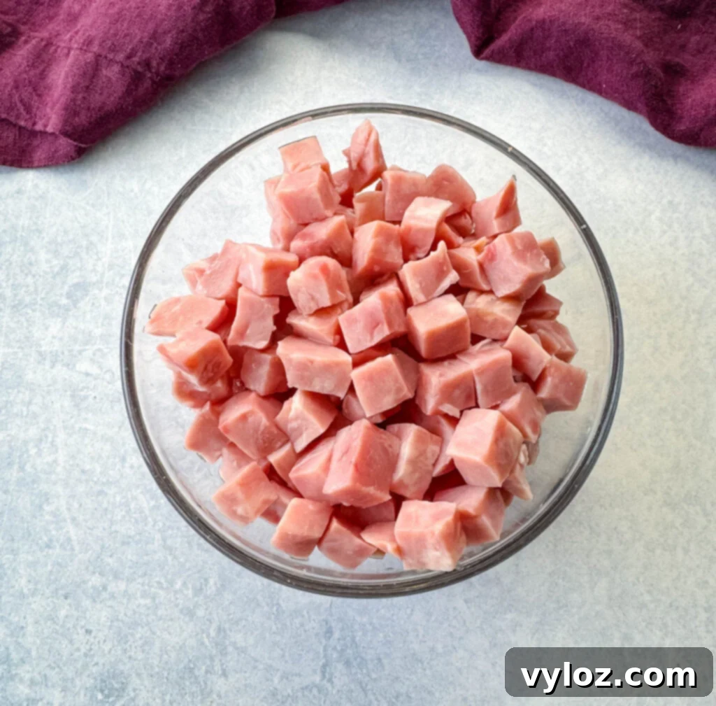 Classic Ham Pasta Salad 6 diced ham in a glass bowl