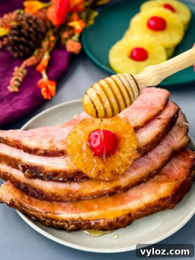 Southern Baked Ham with Pineapple, glazed and topped with cherries for an Easter feast