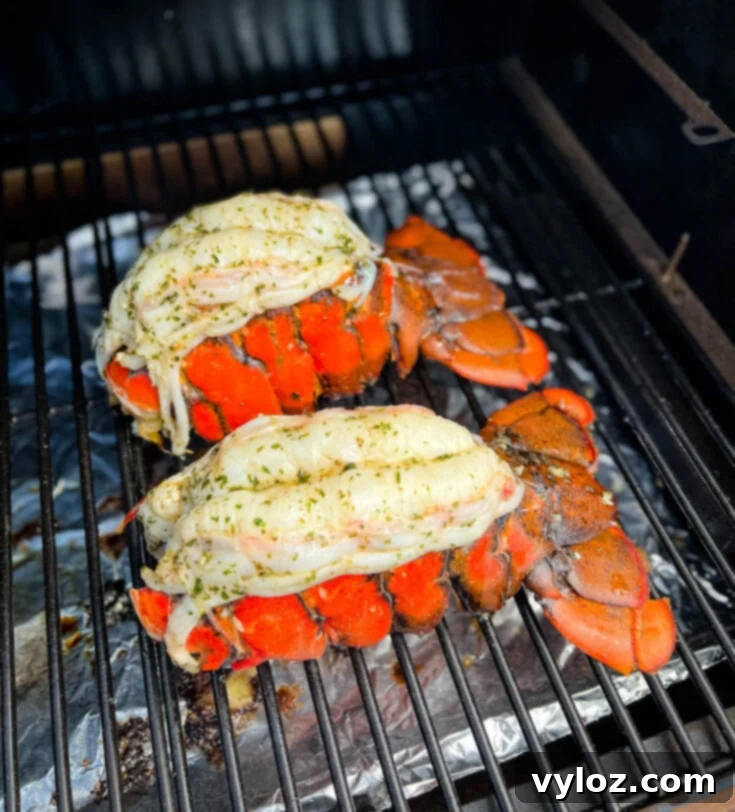 Easy Smoked Lobster Tail, drizzled in Old Bay lemon garlic butter sauce
