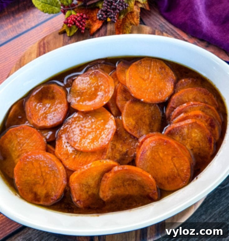 Baked Southern Candied Sweet Potatoes with thick caramelized syrup