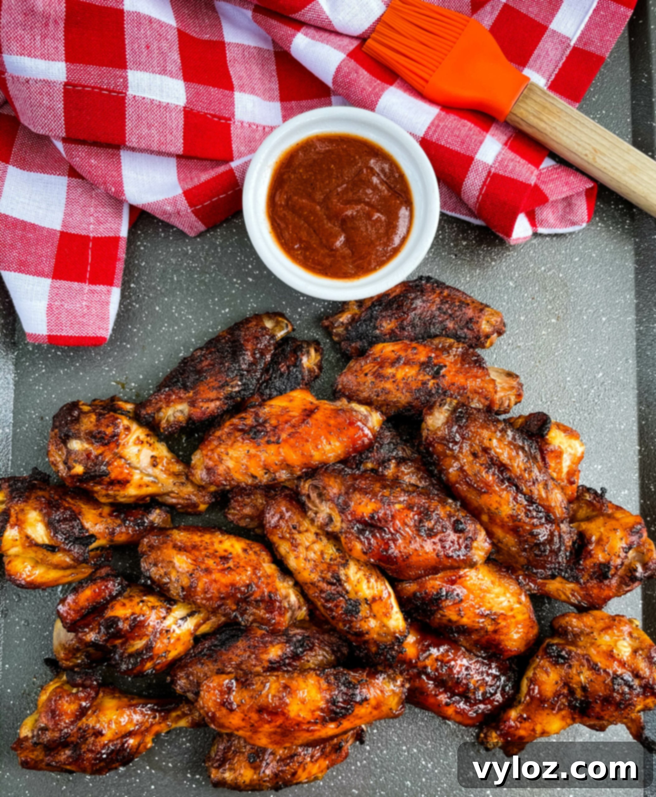 Grilled chicken wings glazed with barbecue sauce, ready to serve at an outdoor cookout