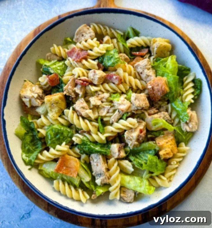 Chicken Caesar Pasta Salad with juicy chicken, crunchy bacon, and Romaine lettuce