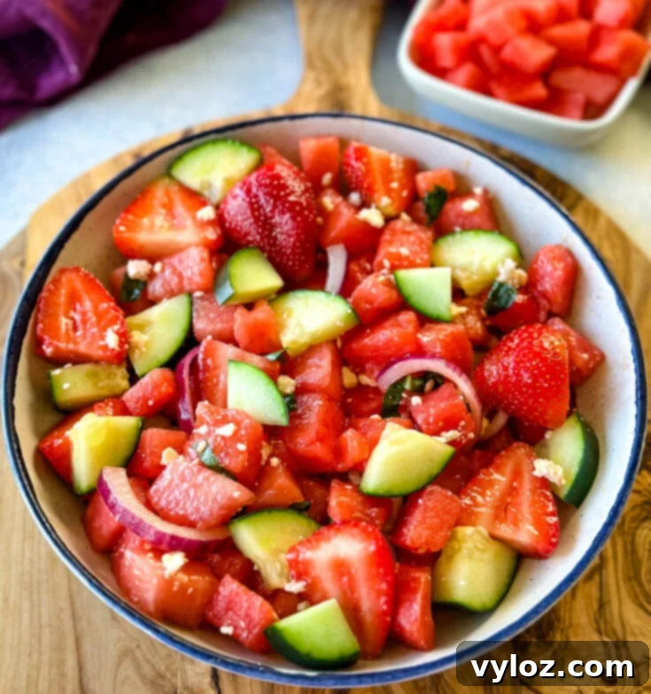 Watermelon Salad with Feta, Avocado, Cucumber, Basil, and Balsamic Lime Dressing