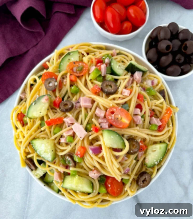 Easy Spaghetti Salad served cold with cooked pasta, veggies, and Italian dressing