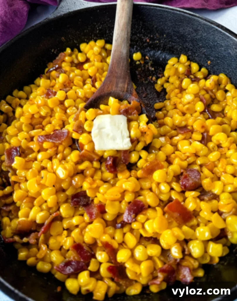 Golden Crispy Fried Corn 2 Southern fried corn with butter and bacon in a cast iron skillet