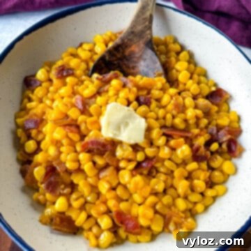 Golden Crispy Fried Corn 12 Southern fried corn with butter and bacon in a white bowl