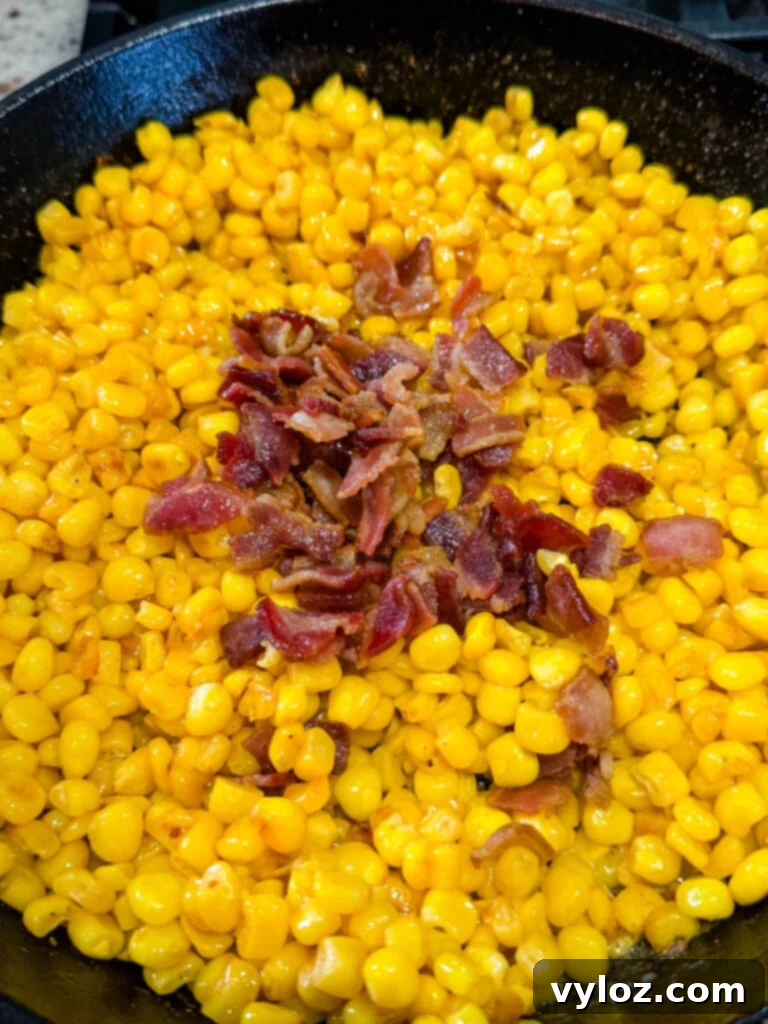 Golden Crispy Fried Corn 7 Southern fried corn with bacon in a cast iron skillet