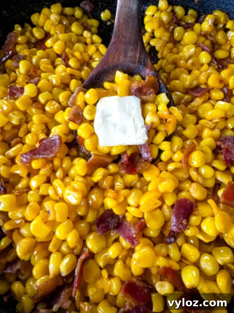 Golden Crispy Fried Corn 9 Southern fried corn with butter and bacon in a cast iron skillet