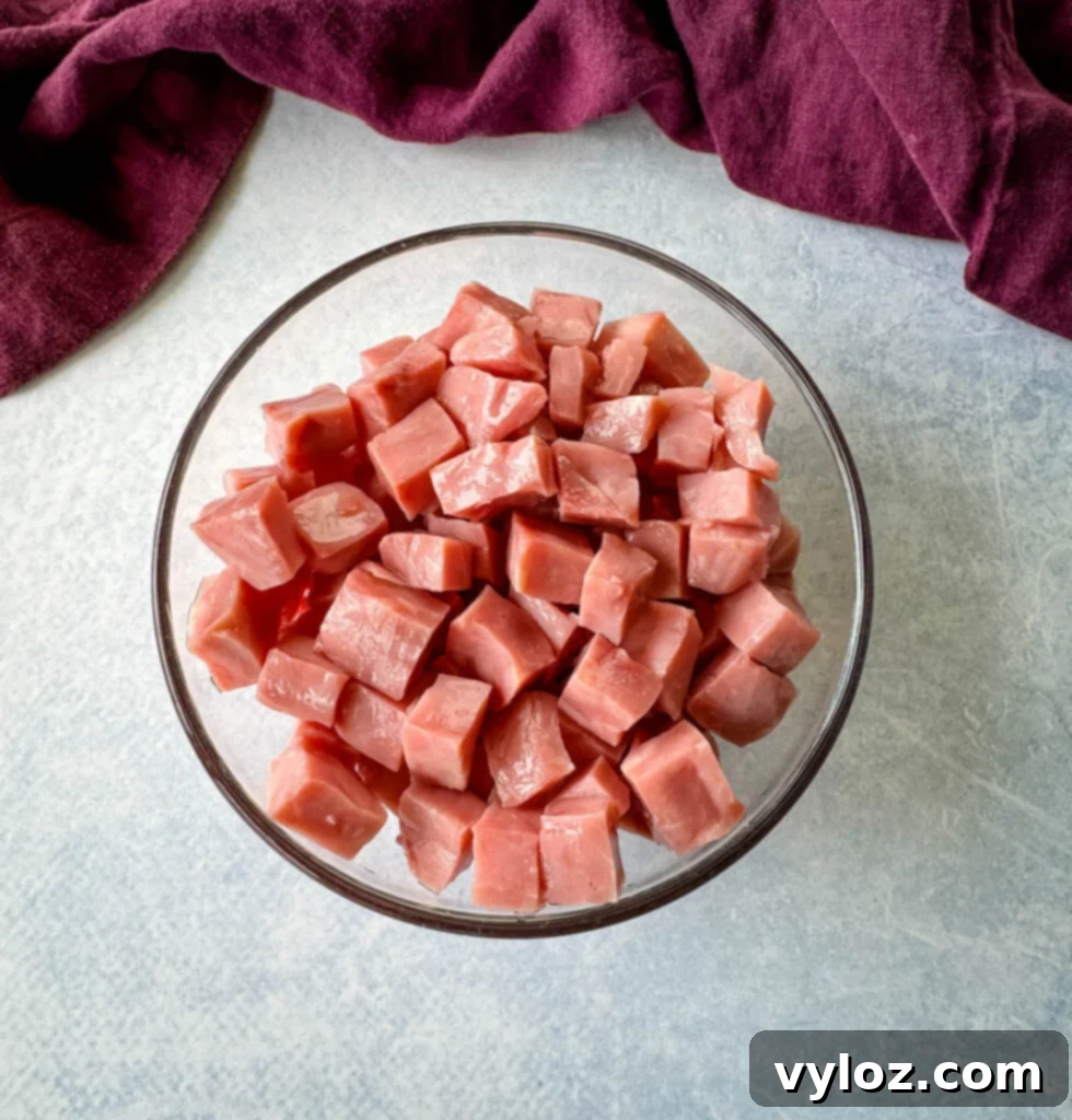 Classic Creamy Ham Salad 4 diced cubes of ham in a glass bowl