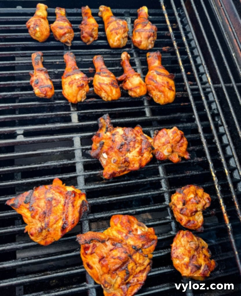 chicken thighs and drumsticks on a grill