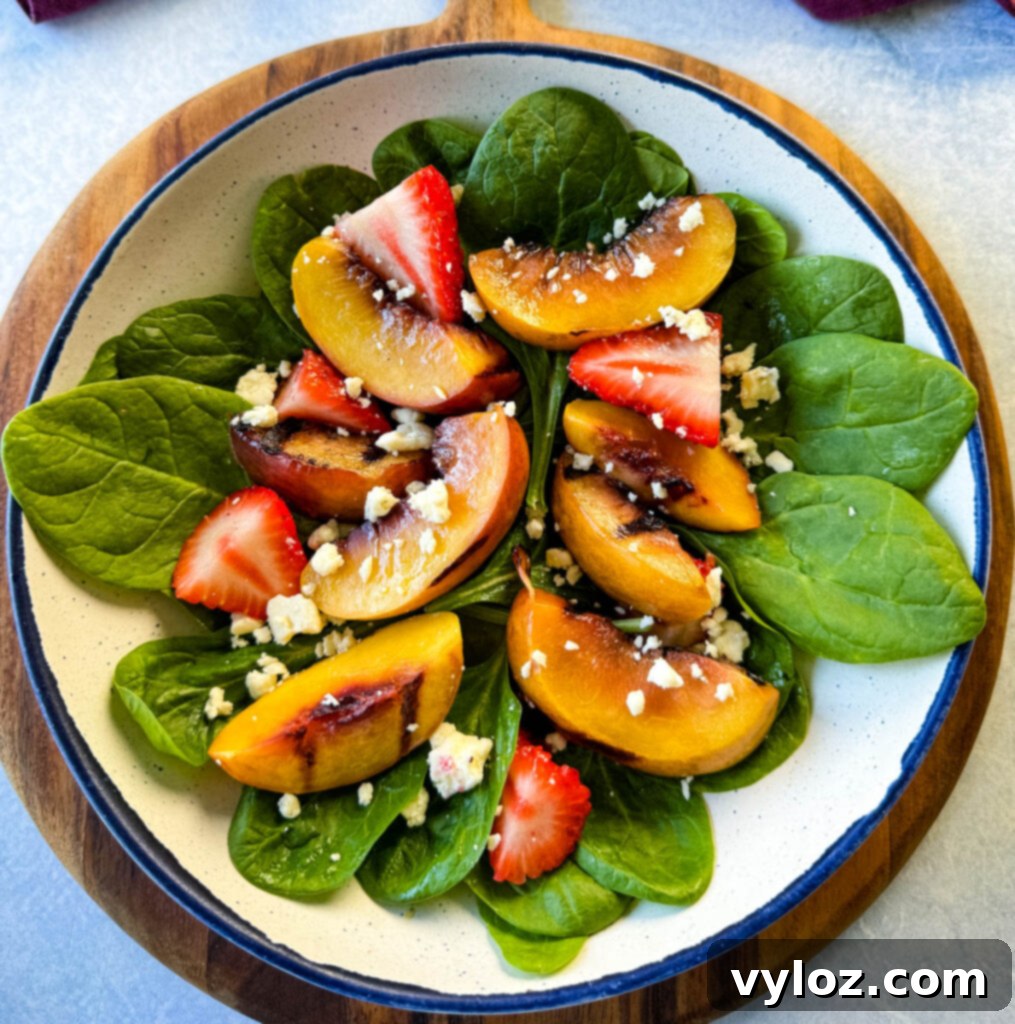 salad with grilled peaches, strawberries, and cheese