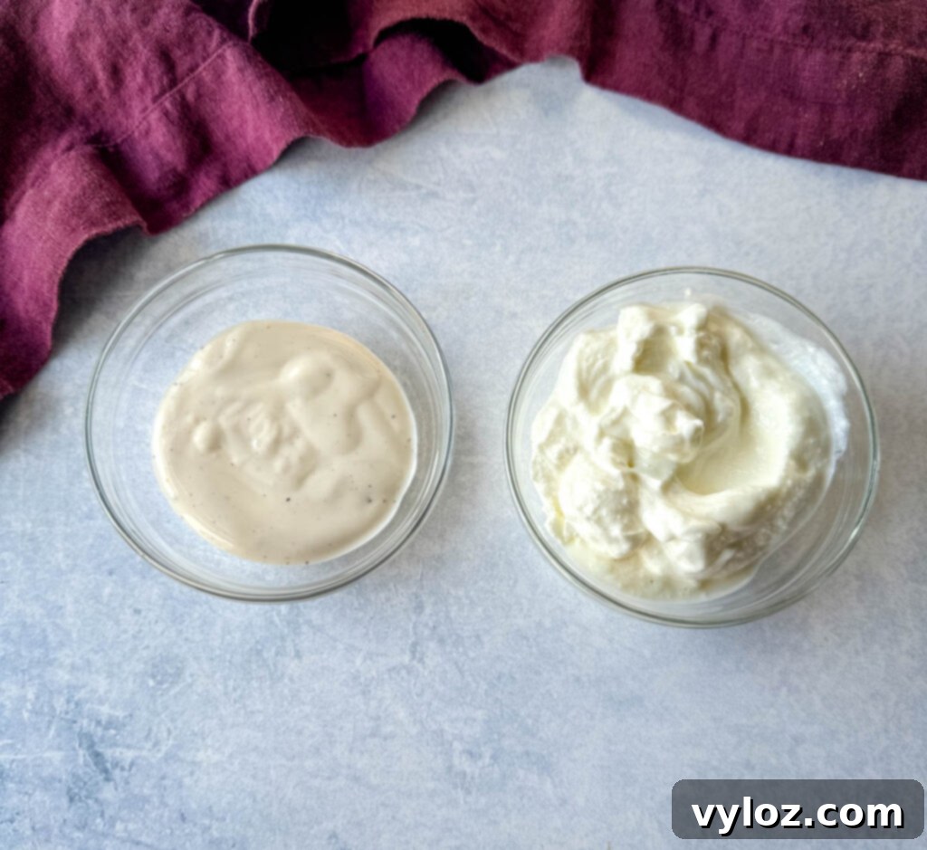 Ranch dressing and plain Greek yogurt in separate glass bowls